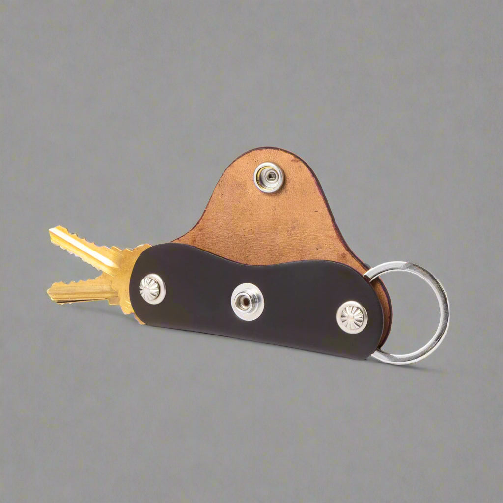 Key organizer with brown leather on a white background