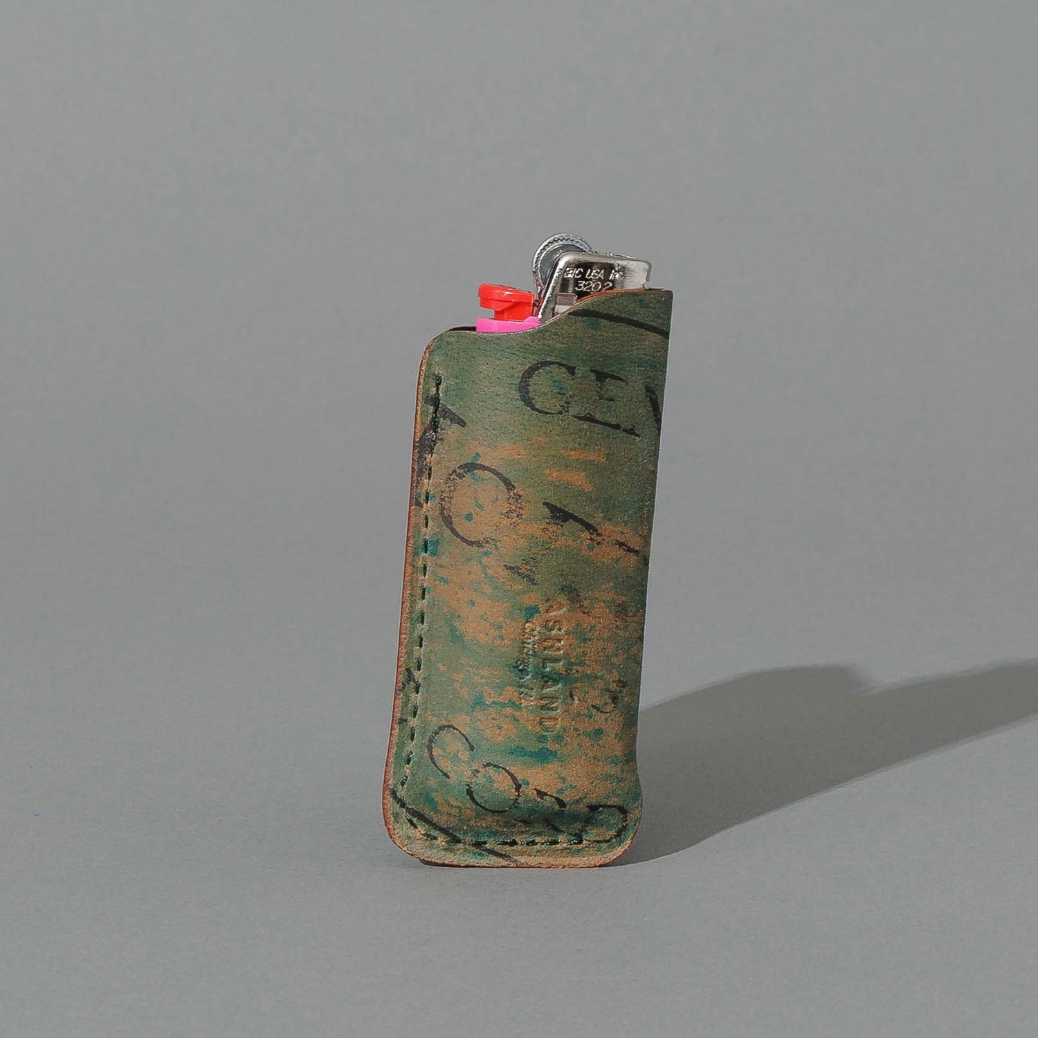One-Off BIC Lighter and Sheath in Reverse Blue Shell Cordovan, standing upright, side angle, shot 1