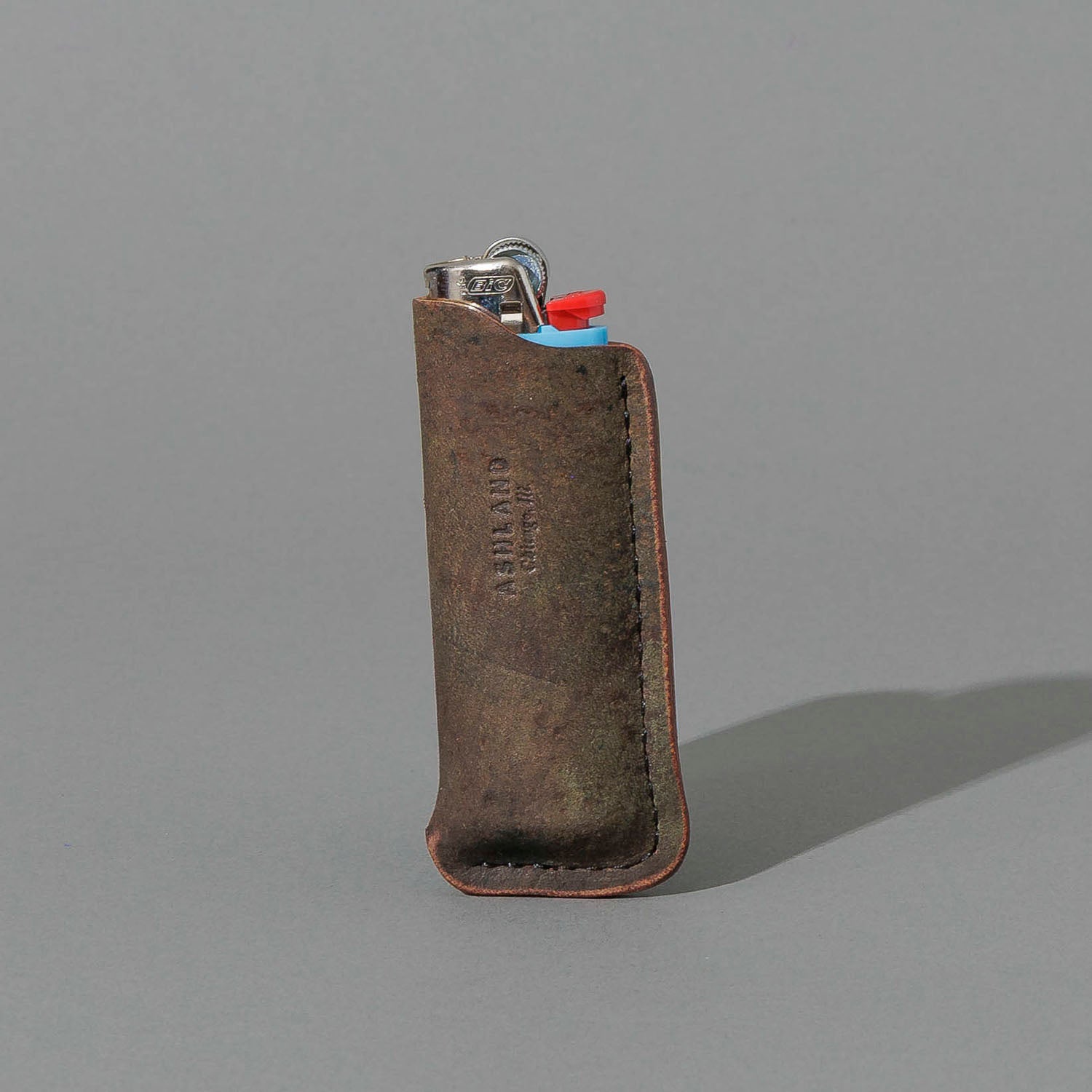 One-Off BIC Lighter and Sheath in Reverse Shell Cordovan, standing upright, side angle, shot 1