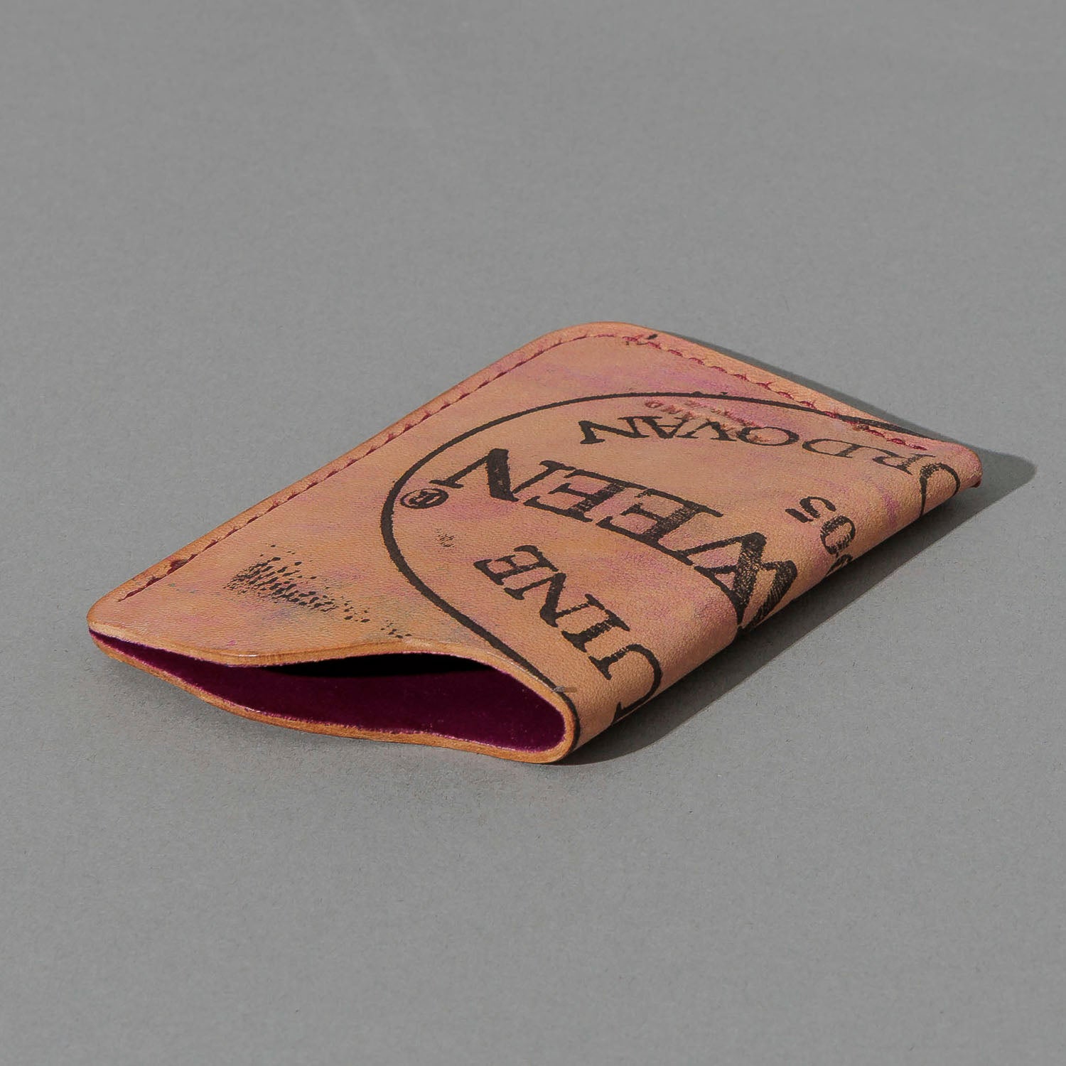 One-Off One-Shot Card Case in Reverse Ultraviolet Shell Cordovan, angled view lying flat