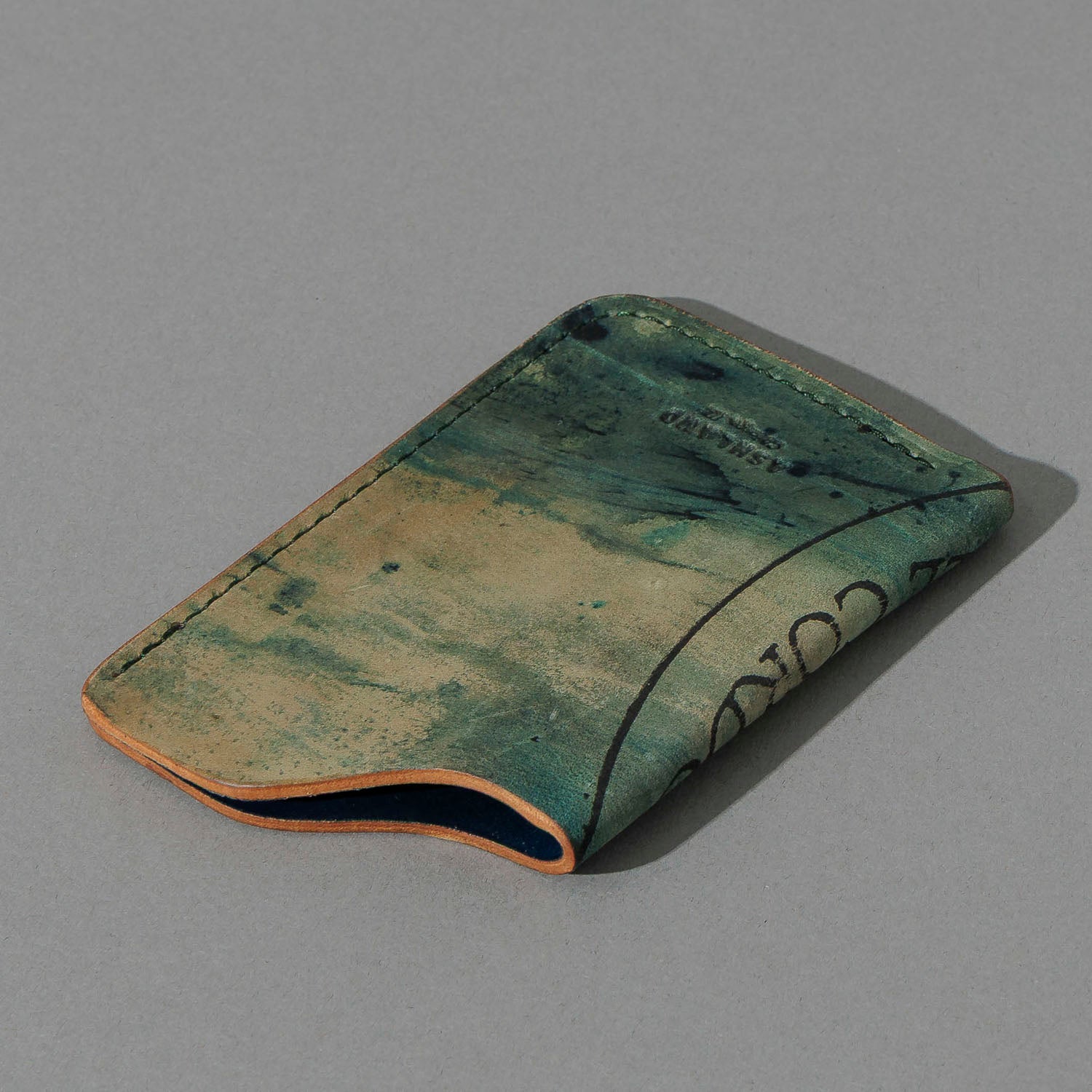 One-Off One-Shot Card Case in Reverse Green Shell Cordovan, angled view lying flat