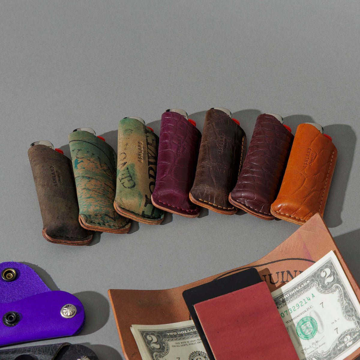 One-Off BIC Lighter and Sheath in Reverse Blue Shell Cordovan, group shot with other Fall Limited Release pieces