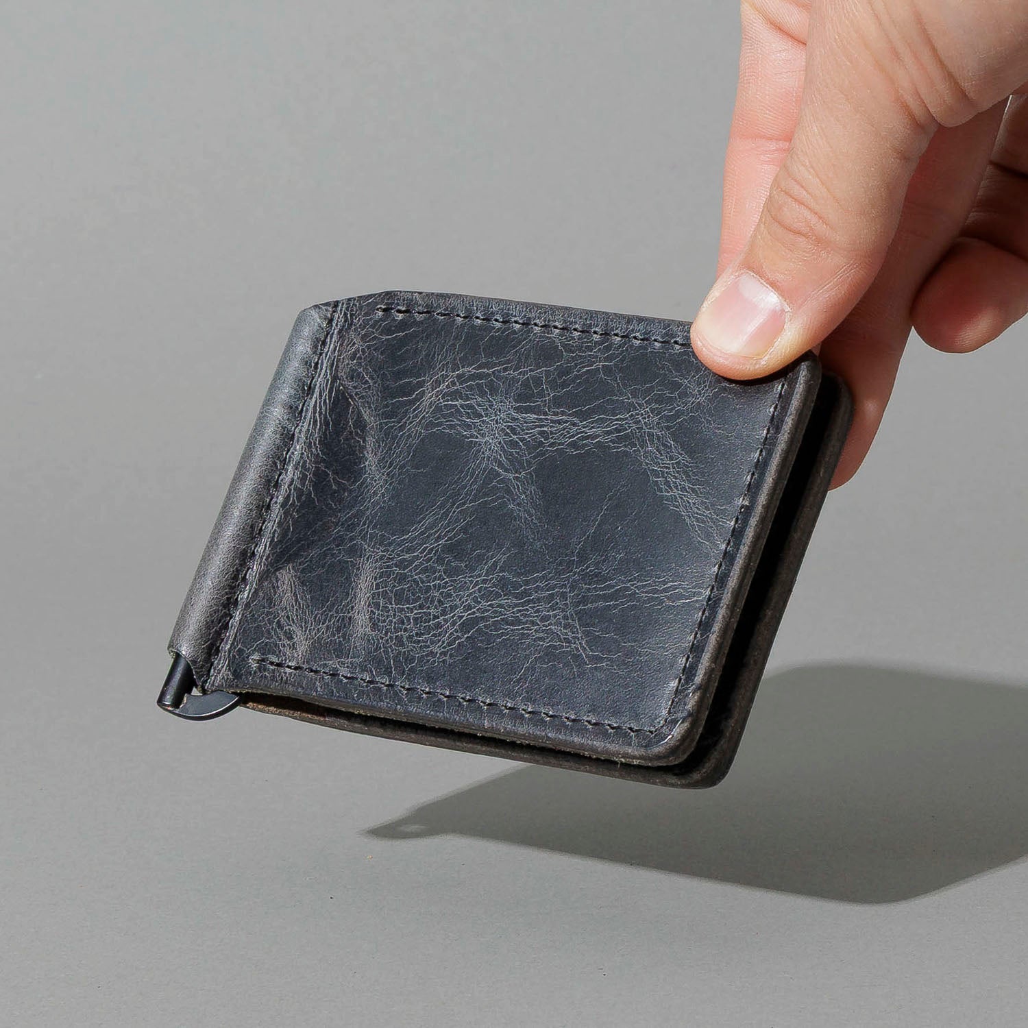 Capone Money Clip in Slate Vintage, held in hand, shot 1
