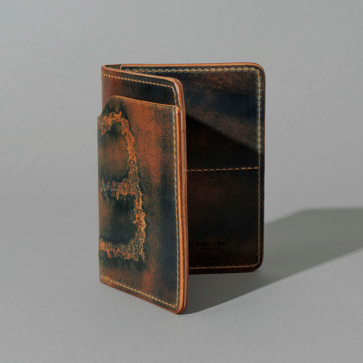 One-Off Fat Herbie in Branded Marbled Black Shell Cordovan, standing upright, side angle