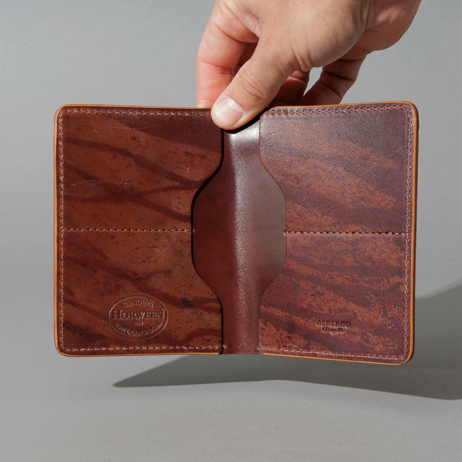One-Off Fat Herbie in Hand-Glazed Epic Splatter Reverse Color 8 Shell Cordovan, held open in hand, shot 1
