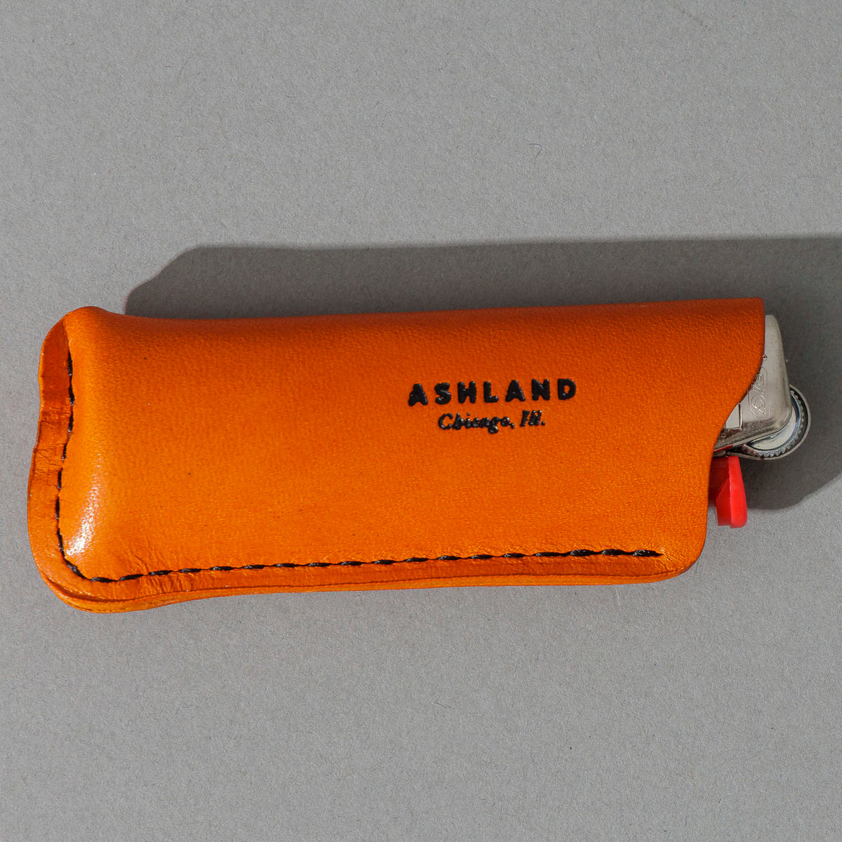 Lighter in Orange Latigo, close-up detail