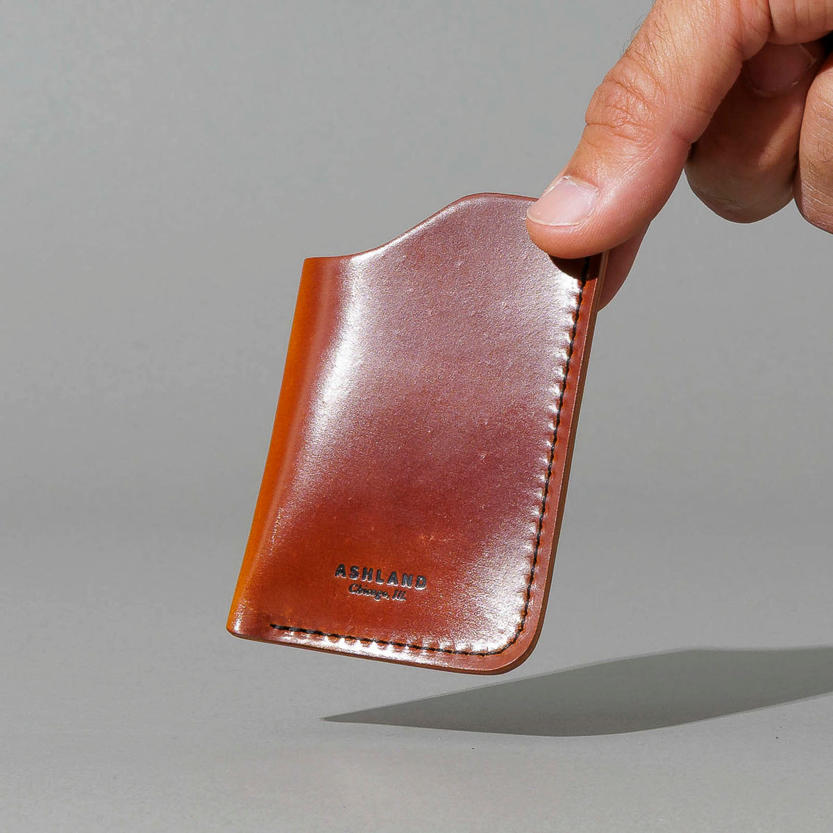 One-Off One-Shot Card Case in Blood Orange Shell Cordovan, held in hand, shot 3
