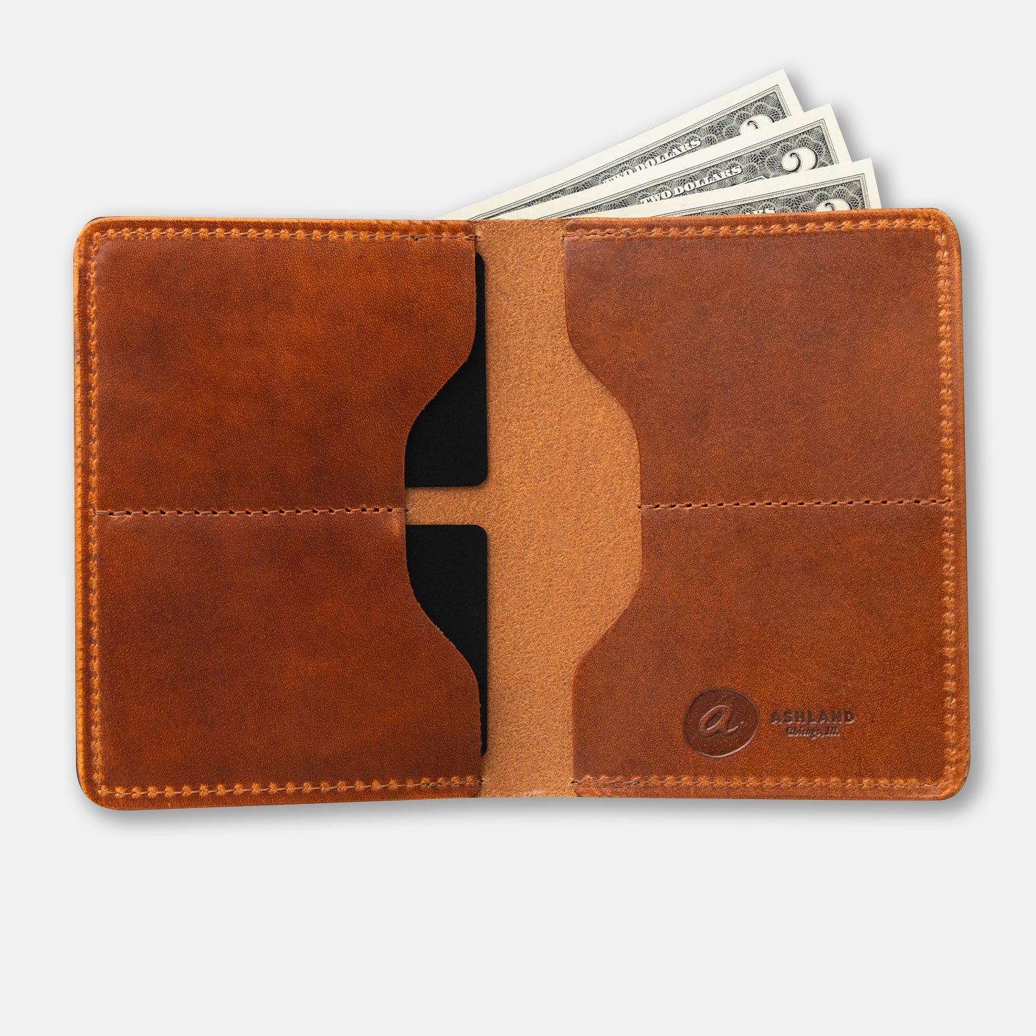 A brown, bi-fold leather wallet with card slots and some cash protruding from the bill slot, placed on a flat surface.