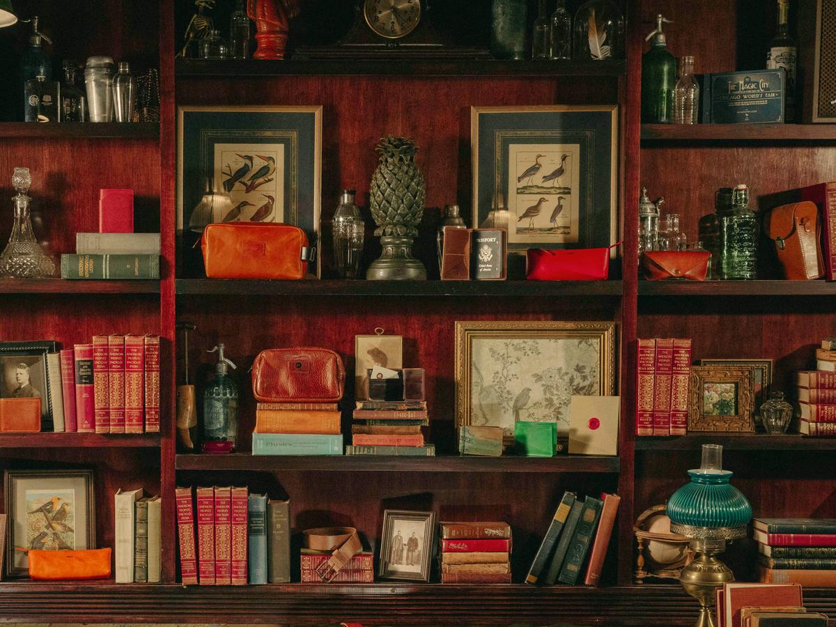Ashland Leather goods on a mahogany bookshelf