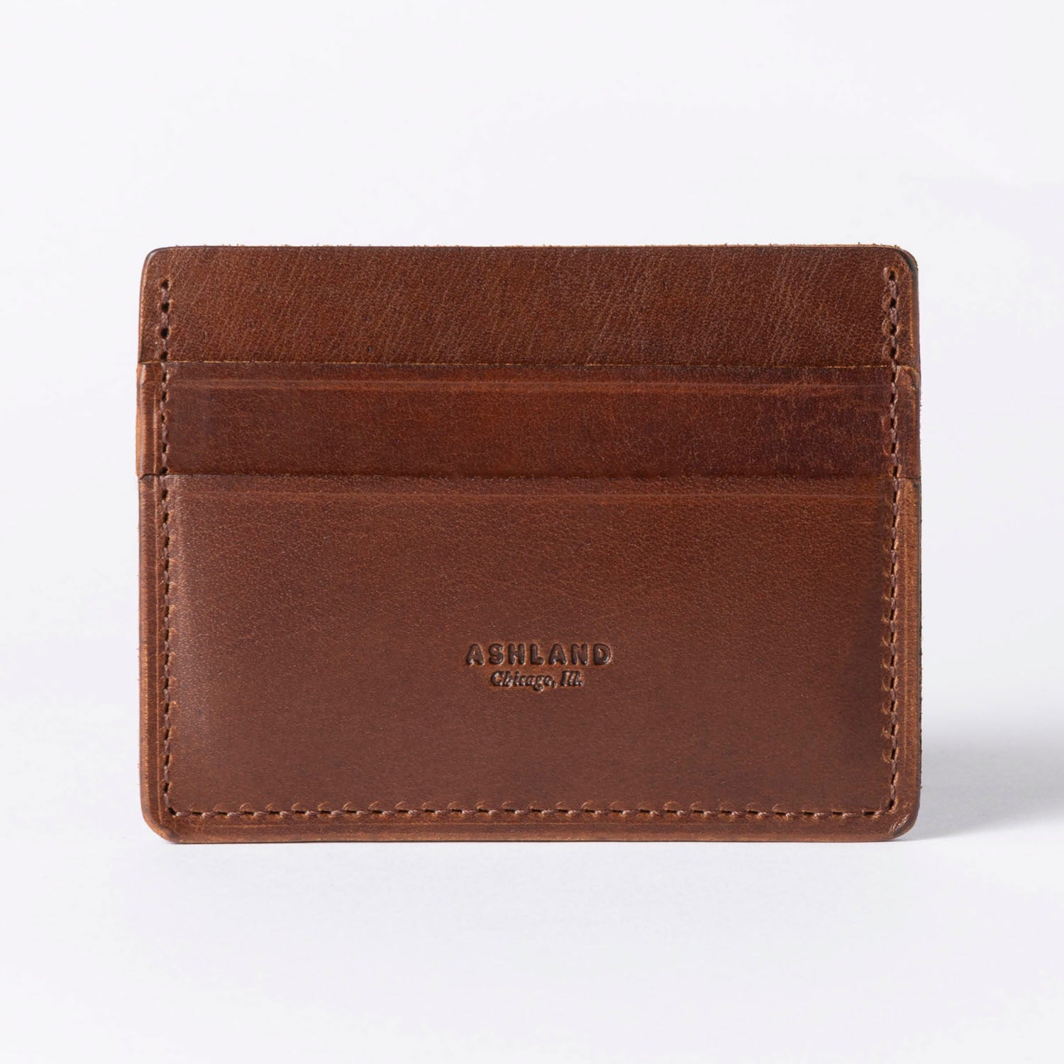 Brown leather cardholder with 'Ashland' branding on a white background