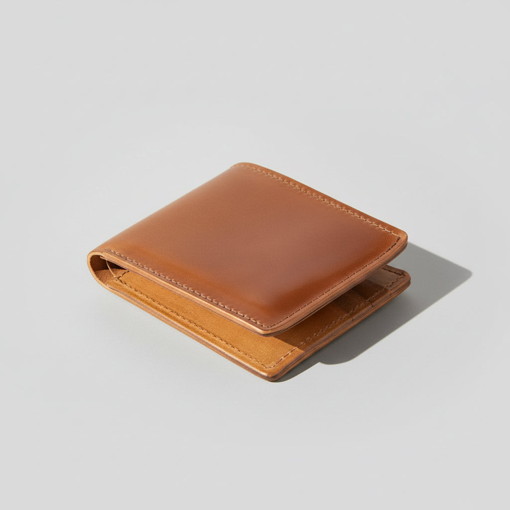 Brown leather wallet on a light gray background