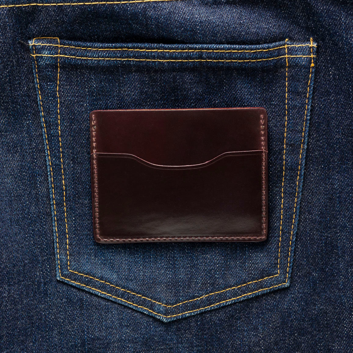 shell cordovan leather wallet on jeans