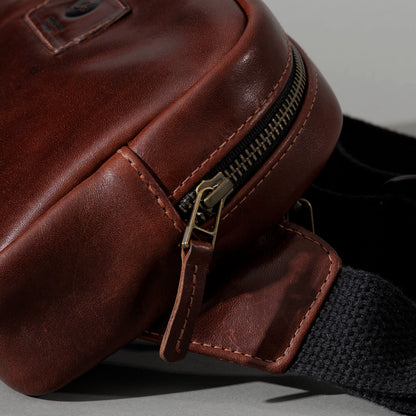 Sling Bag in Horween® Chromexcel® Brown Wooly horsehide, zipper end and strap tab close-up