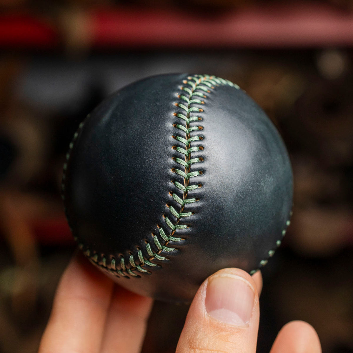 closeup on a white baseball ball with red thread, black background Stock  Photo