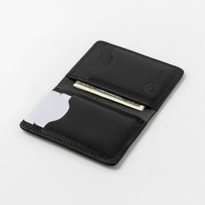 Angled view of the open Vertical Bugs Moran in black Horween® Dublin on white, showing the slots and a folded bill