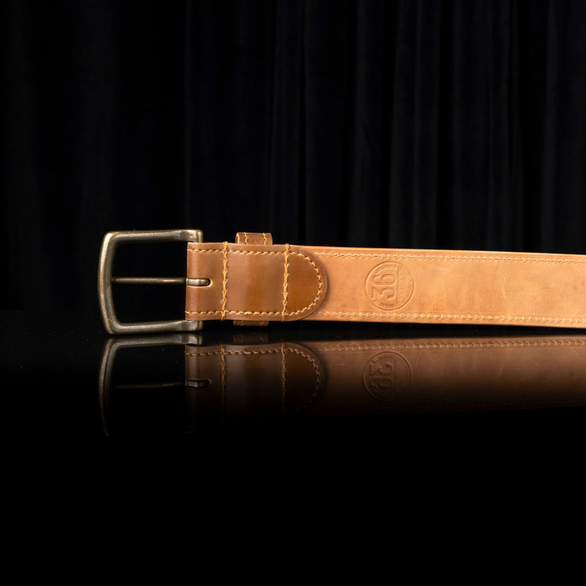 Ashland Leather Horween® leather belt on a black background