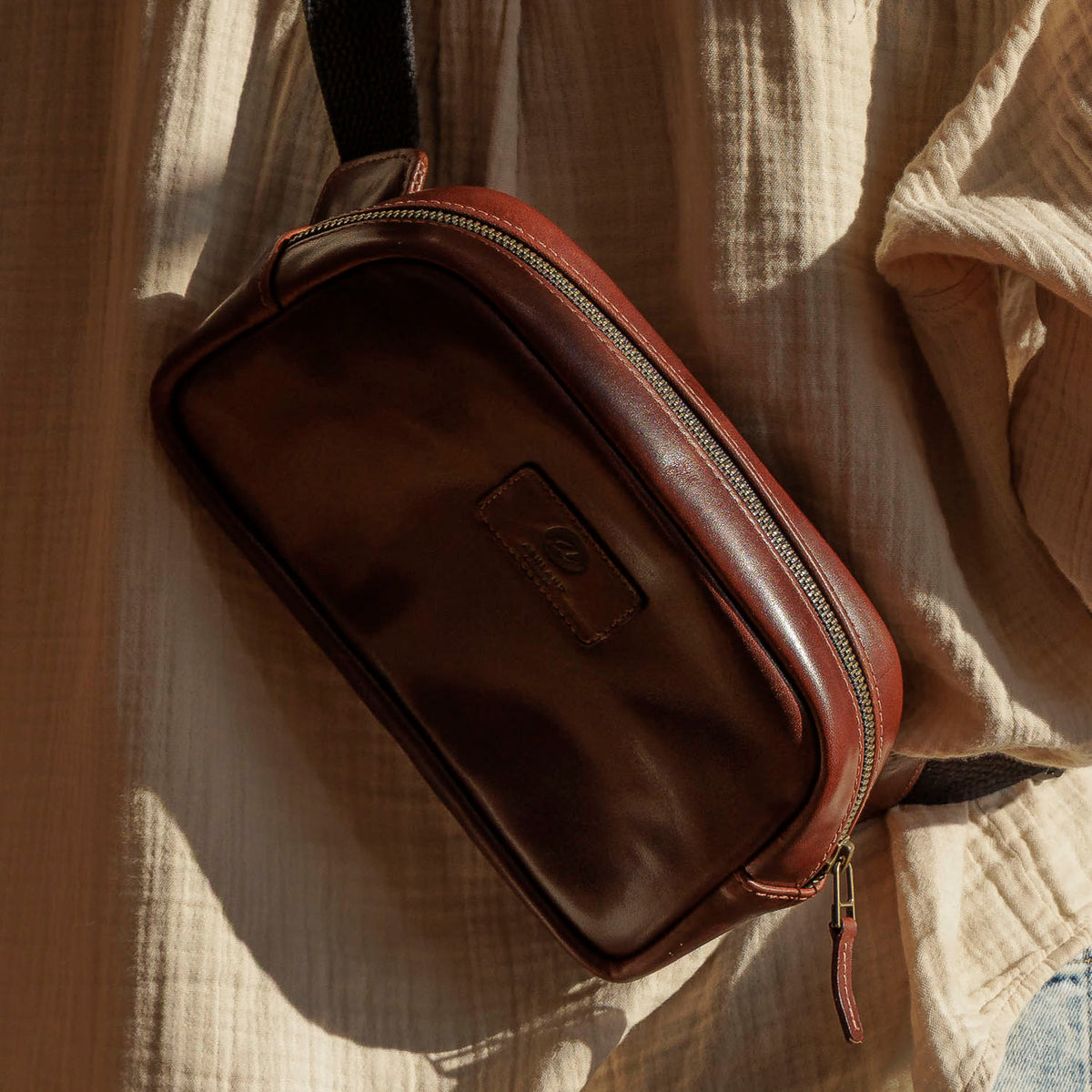 Sling Bag in Horween® Chromexcel® Brown Wooly horsehide, close-up of the leather character in warm light