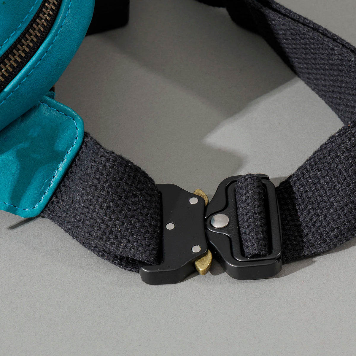 One-off Sling Bag in Horween® Teal Latigo leather, die-cast metal buckle close-up