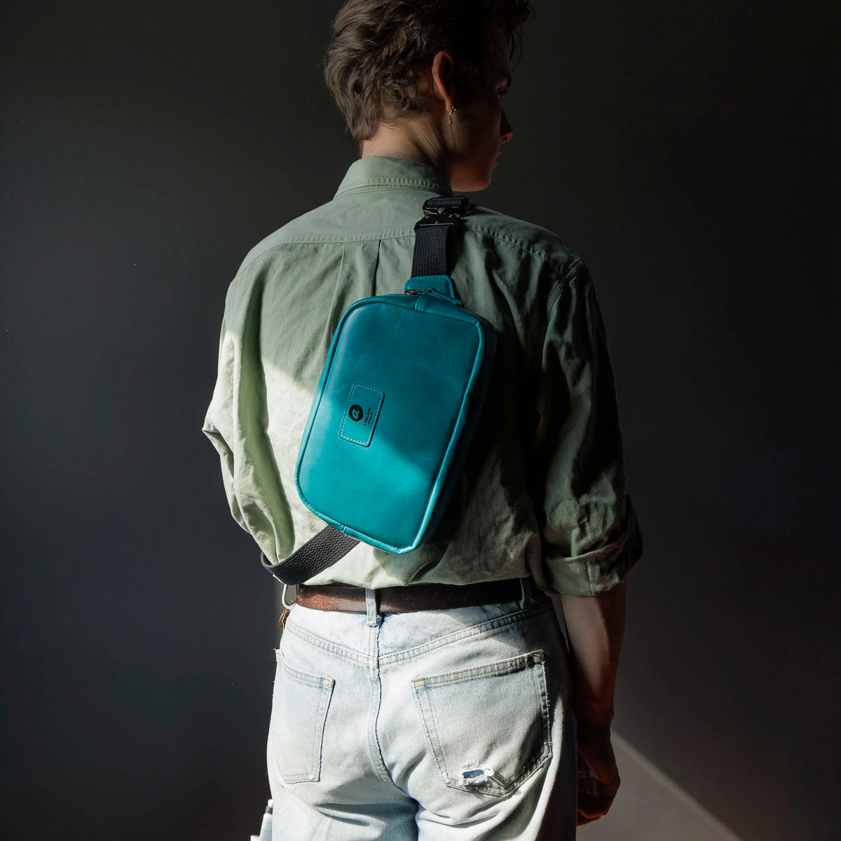 One-off Sling Bag in Horween® Teal Latigo leather, worn on the back, rear view