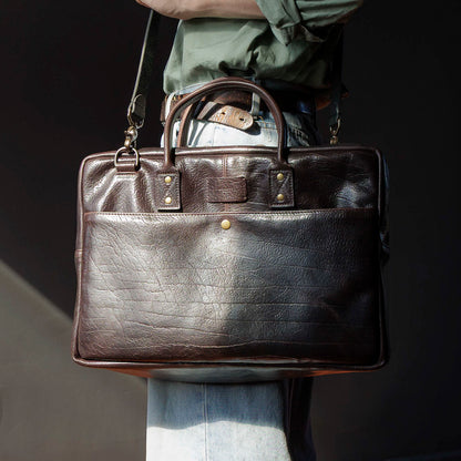 One-off LaSalle Briefcase in Horween® Epic Color 8 Aspen Horsehide, carried by the handles, front view