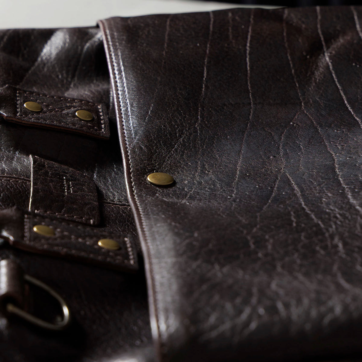 One-off LaSalle Briefcase in Horween® Epic Color 8 Aspen Horsehide, handle tabs and brass hardware close-up