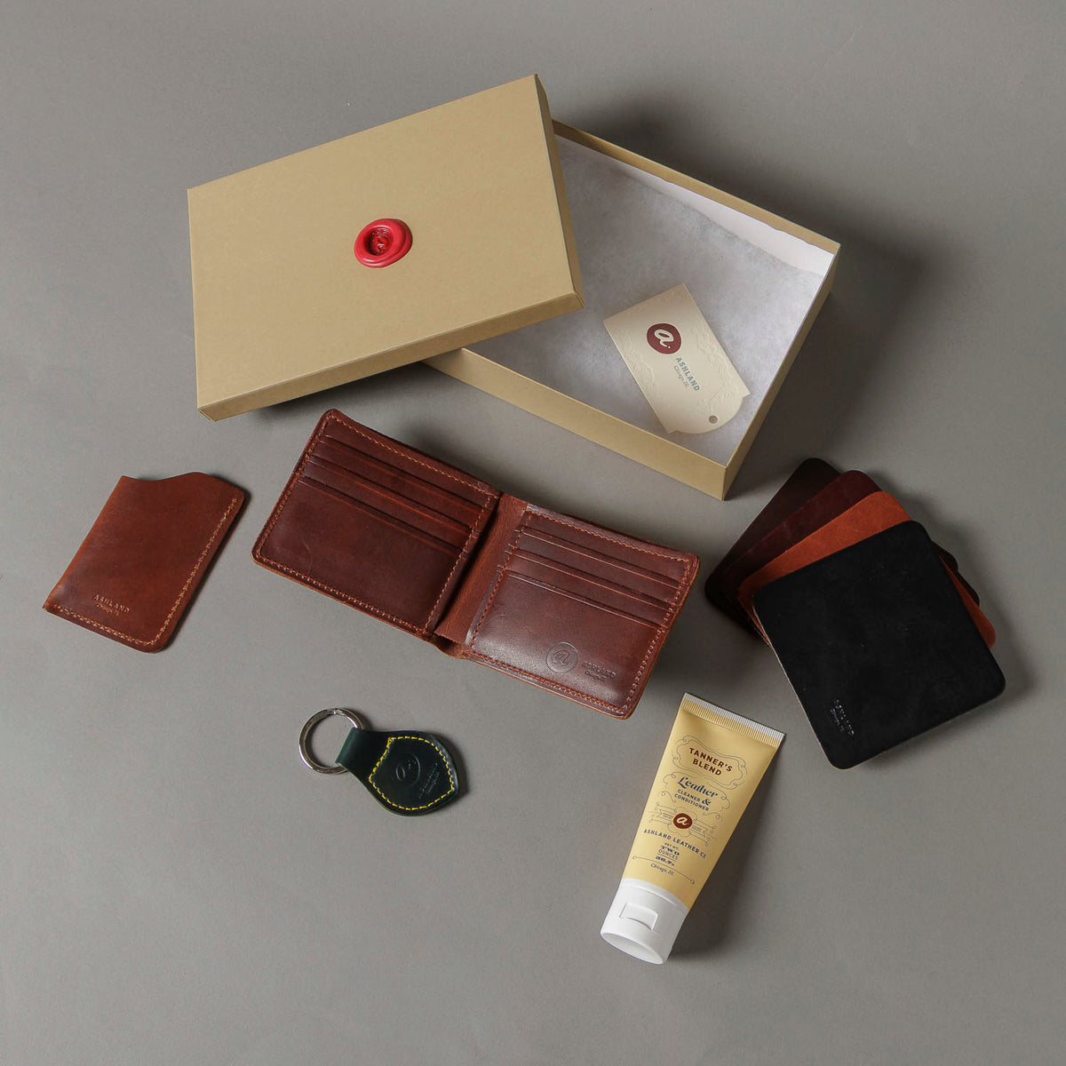 Ashland Leather Mystery Box example contents, Horween® leather bifold wallet, card cases, key fob and leather care cream