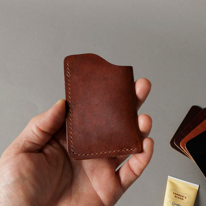 Ashland Leather Mystery Box, brown Horween® leather front pocket card wallet held in hand
