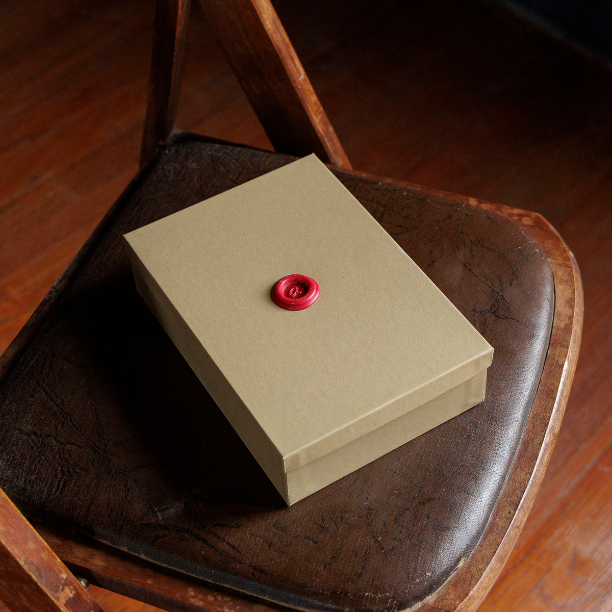 Ashland Leather Mystery Box, closed kraft gift box with red wax seal