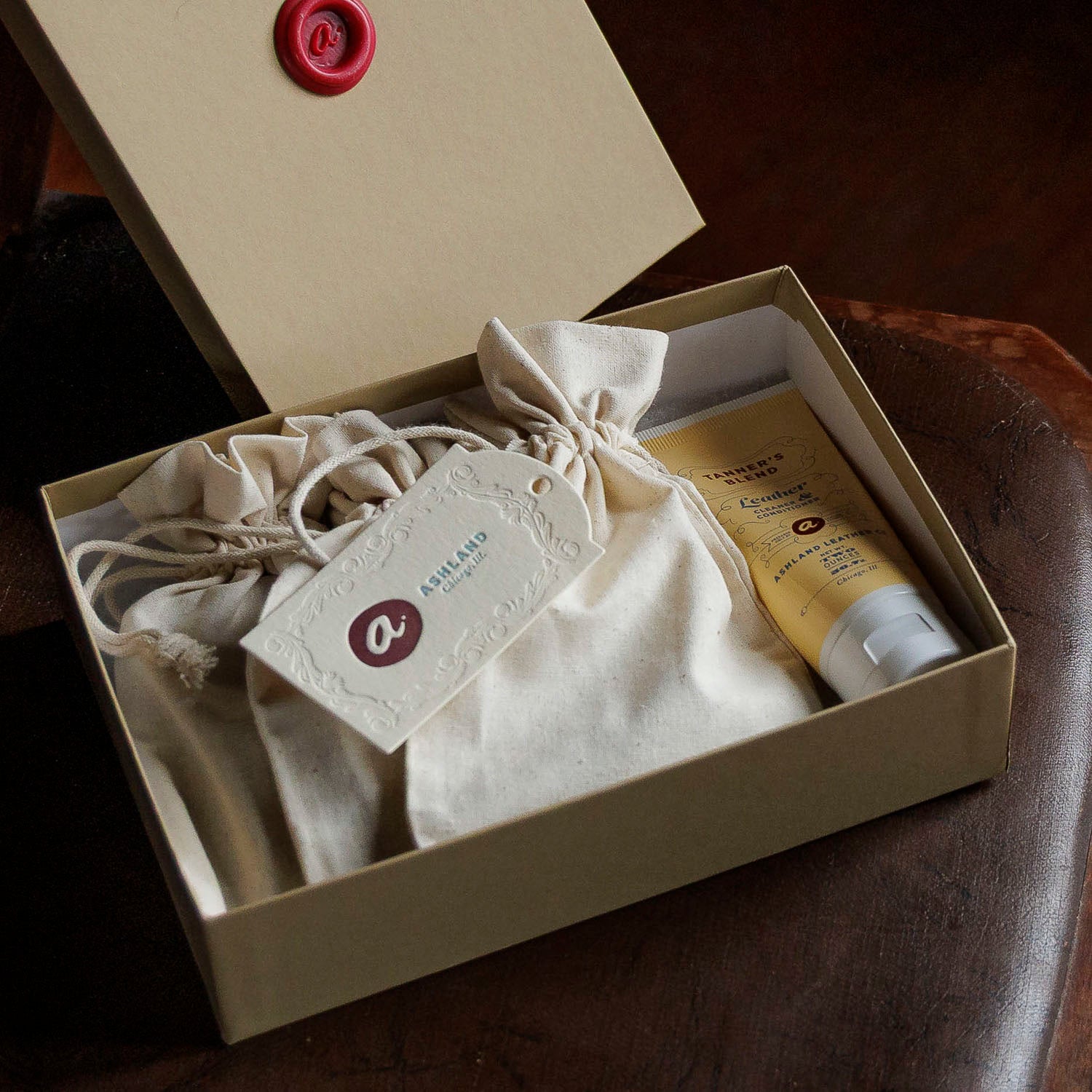 Ashland Leather Mystery Box opened, cotton pouch, leather care cream and Ashland tag inside