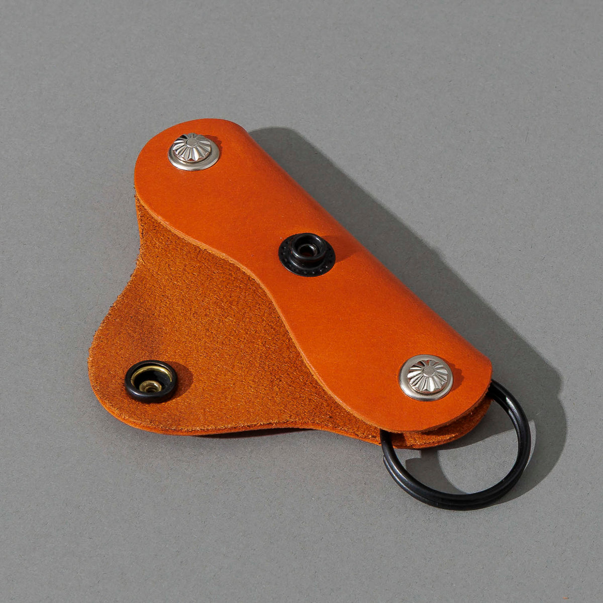 Vault Key Holder in Orange Latigo, opened to show where keys sit, shot 2