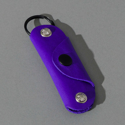 Vault Key Holder in Violet Latigo, angled view lying flat