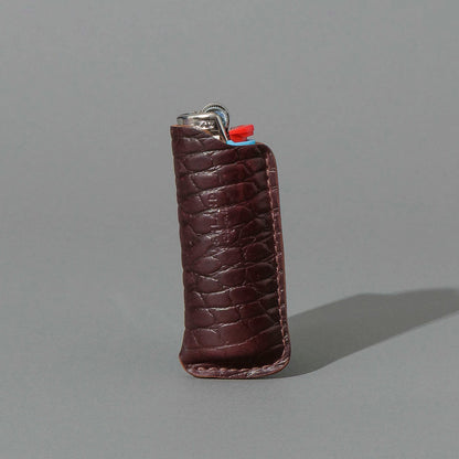 One-Off BIC Lighter and Sheath in Gator Color 8 Shell Cordovan, standing upright, side angle, shot 1
