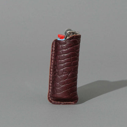 One-Off BIC Lighter and Sheath in Gator Color 8 Shell Cordovan, standing upright, side angle, shot 2
