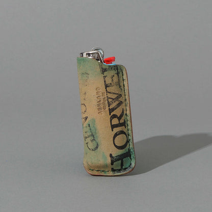 One-Off BIC Lighter and Sheath in Reverse Blue Shell Cordovan, standing upright, side angle, shot 1