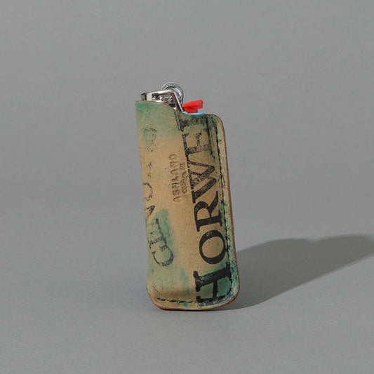 One-Off BIC Lighter and Sheath in Reverse Blue Shell Cordovan, standing upright, side angle, shot 1
