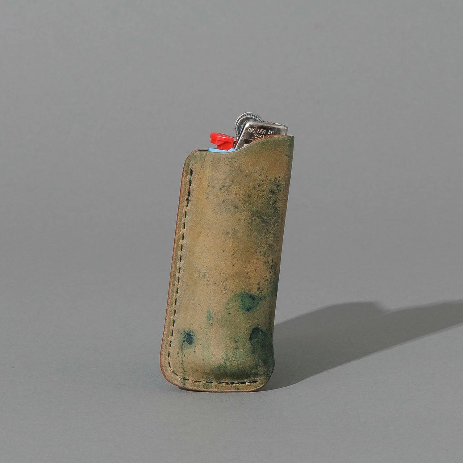 One-Off BIC Lighter and Sheath in Reverse Blue Shell Cordovan, standing upright, side angle, shot 2