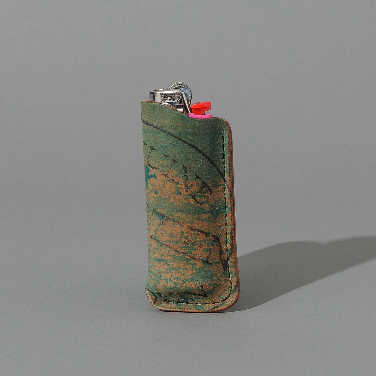 One-Off BIC Lighter and Sheath in Reverse Blue Shell Cordovan, standing upright, side angle, shot 2