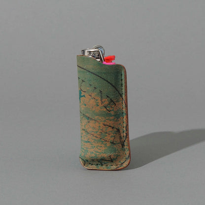 One-Off BIC Lighter and Sheath in Reverse Blue Shell Cordovan, standing upright, side angle, shot 2