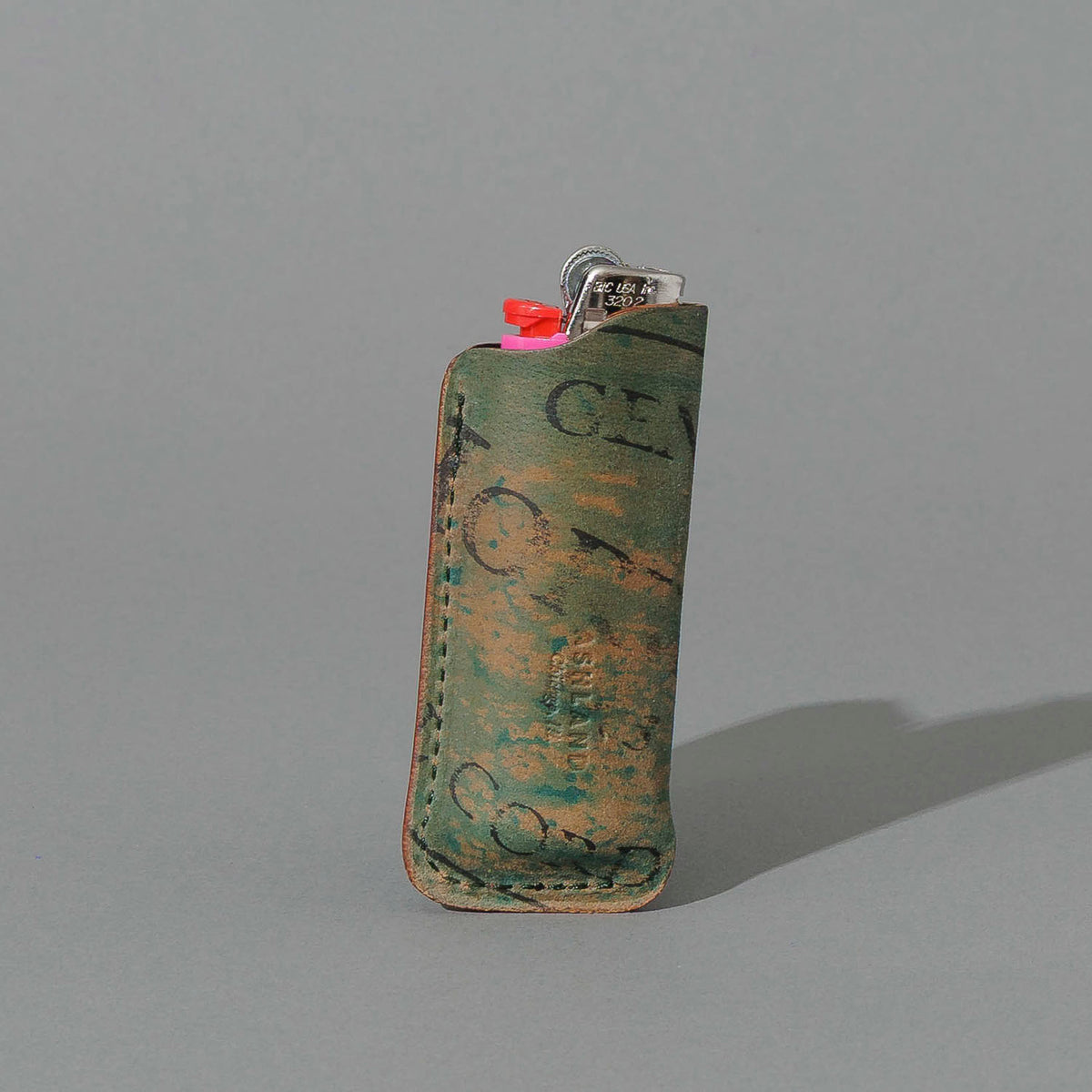One-Off BIC Lighter and Sheath in Reverse Blue Shell Cordovan, standing upright, side angle, shot 1