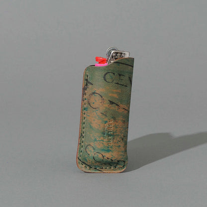 One-Off BIC Lighter and Sheath in Reverse Blue Shell Cordovan, standing upright, side angle, shot 1