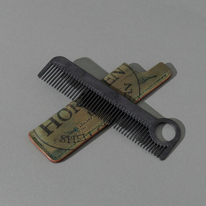 Chicago Comb and Leather Sheath in Reverse Shell Cordovan, with a black Chicago Comb crossed over the sheath
