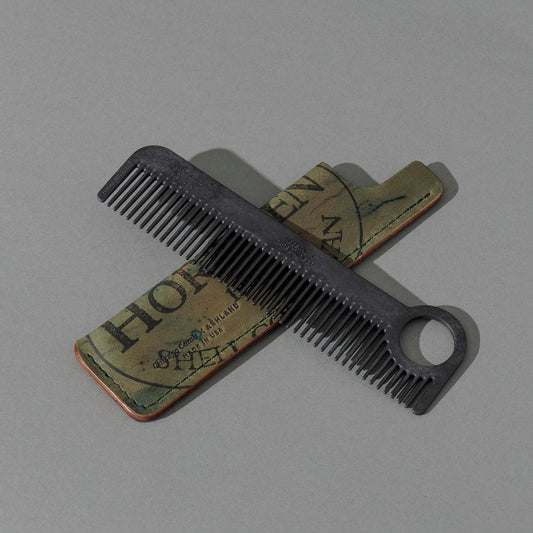 Chicago Comb and Leather Sheath in Reverse Shell Cordovan, with a black Chicago Comb crossed over the sheath