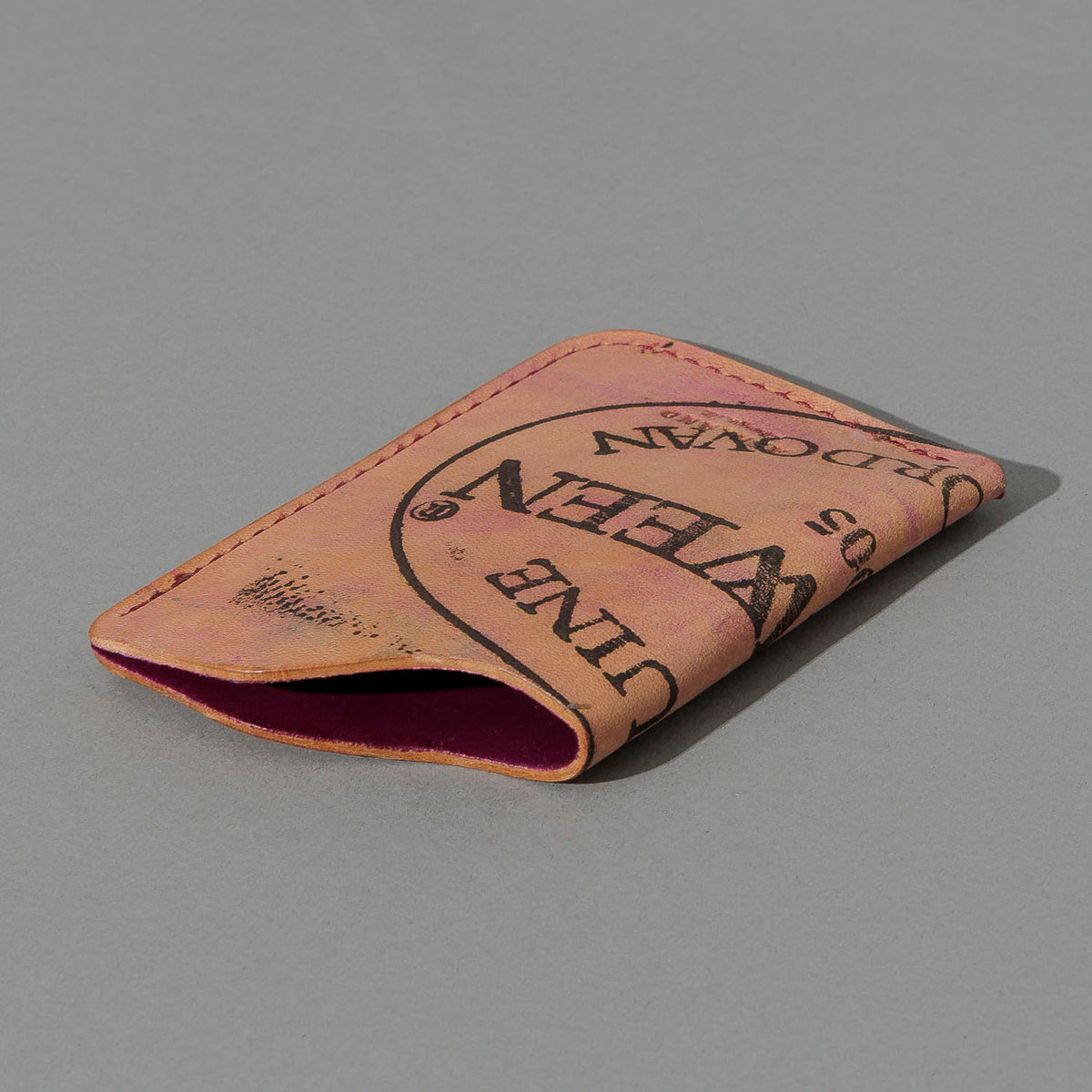 One-Off One-Shot Card Case in Reverse Ultraviolet Shell Cordovan, angled view lying flat
