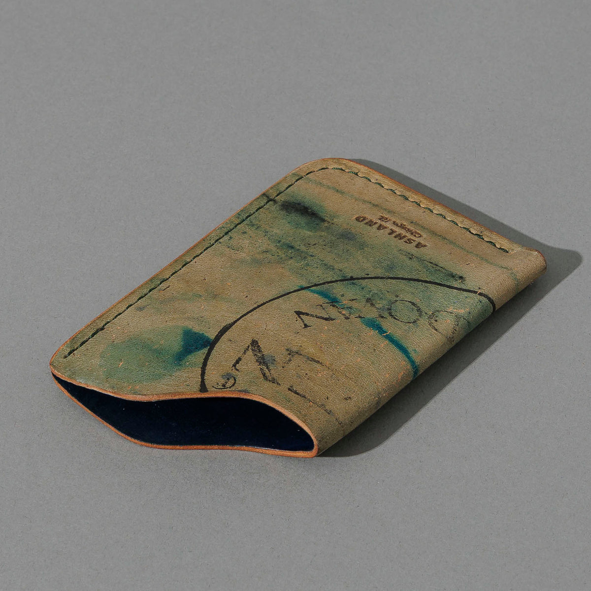 One-Off One-Shot Card Case in Reverse Green Shell Cordovan, angled view lying flat