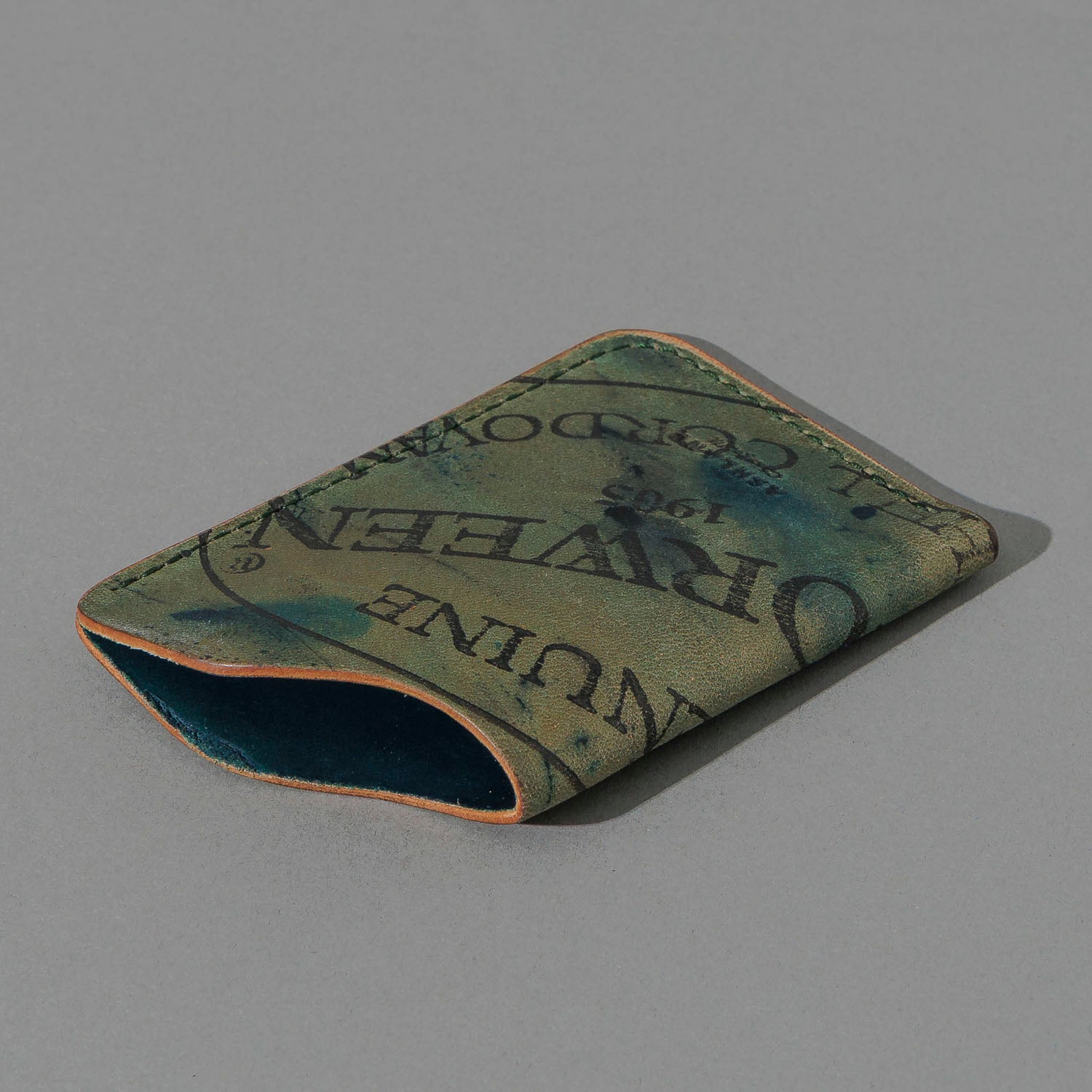 One-Off One-Shot Card Case in Reverse Green Shell Cordovan, angled view lying flat