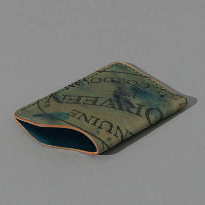 One-Off One-Shot Card Case in Reverse Green Shell Cordovan, angled view lying flat