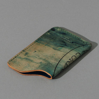 One-Off One-Shot Card Case in Reverse Green Shell Cordovan, angled view lying flat
