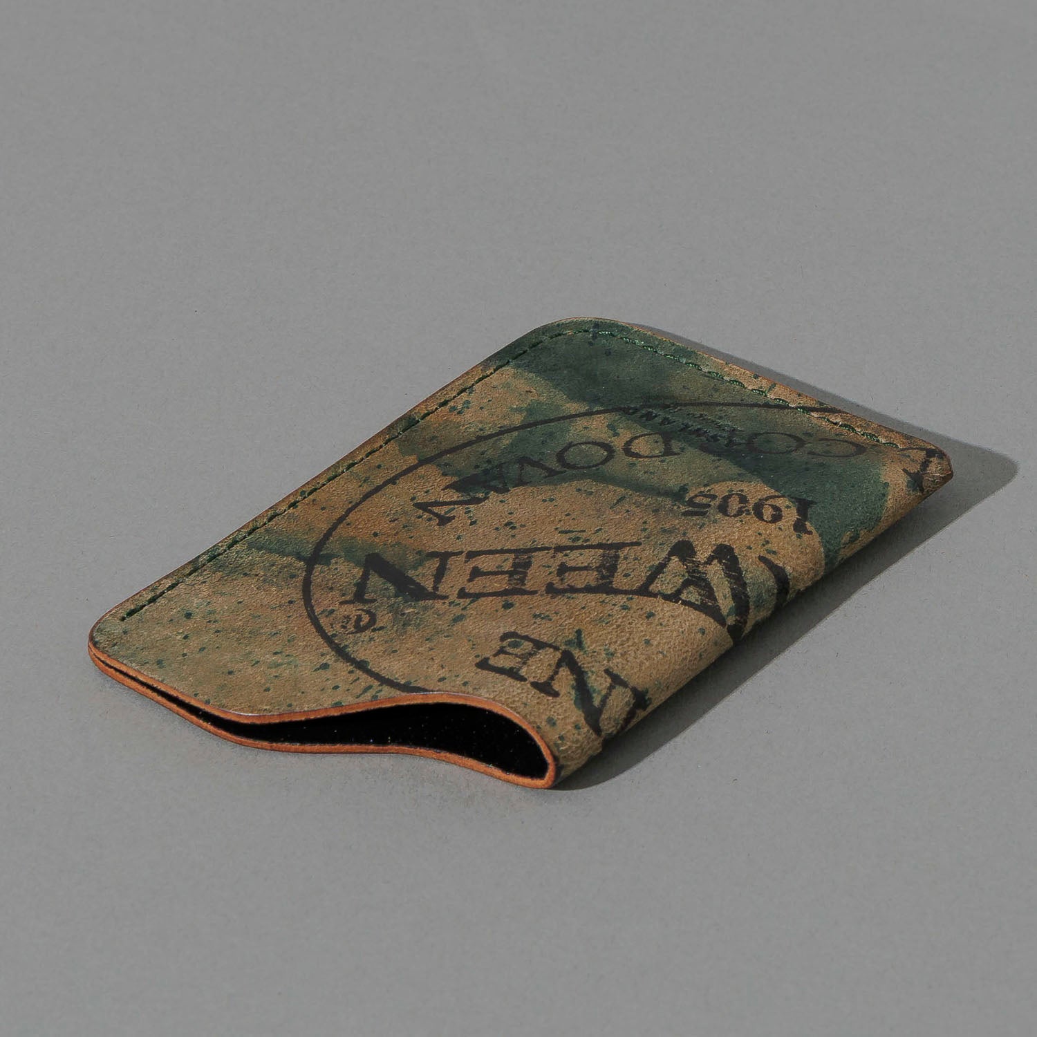 One-Off One-Shot Card Case in Reverse Green Shell Cordovan, angled view lying flat
