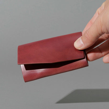 One-Off Jr. Fold in Marbled Ultraviolet Shell Cordovan, held in hand, shot 1