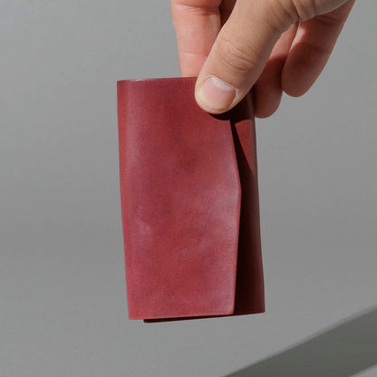 One-Off Jr. Fold in Marbled Ultraviolet Shell Cordovan, held in hand, shot 2